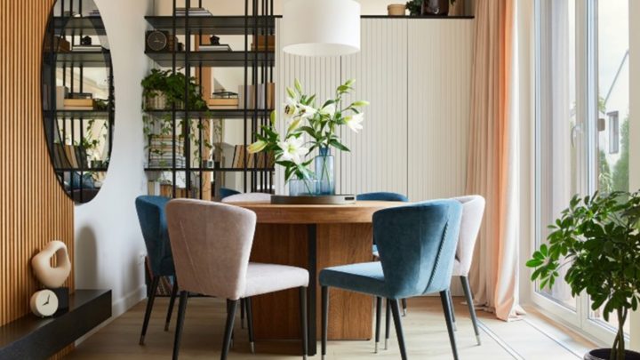 Elegant dining room with velvet armchairs and round table