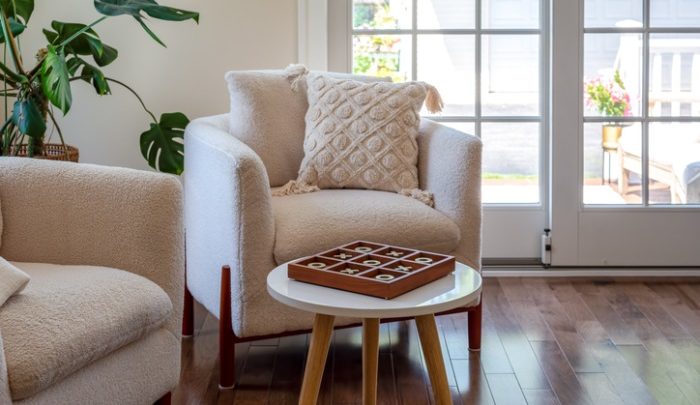 Cozy and stylish chairs in a light and bright sunroom