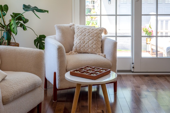 Cozy and stylish chairs in a light and bright sunroom